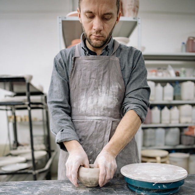 Alex making clay bowl